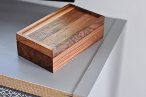 rectangular brown wooden box on table